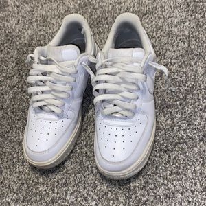 All white Air Force 1’s, Well worn